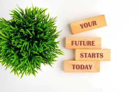 Wood blocks spell your future starts today. Green bush. Proactive, fresh begi Stock Photos