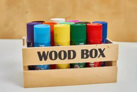 Wood box full of big crayons Stock Photos