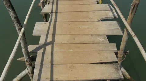 Wood bridge under a river Stock Footage 22224911