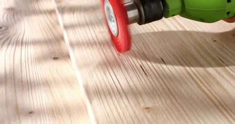 Wood brushing with nylon brush for drill. Close up. Angle view. Stock Footage 243912933