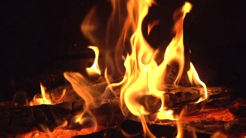 The wood is burning in the fireplace. Video stock 119984061
