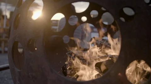 Wood burning inside a spherical fire pit Stock Footage 87614485