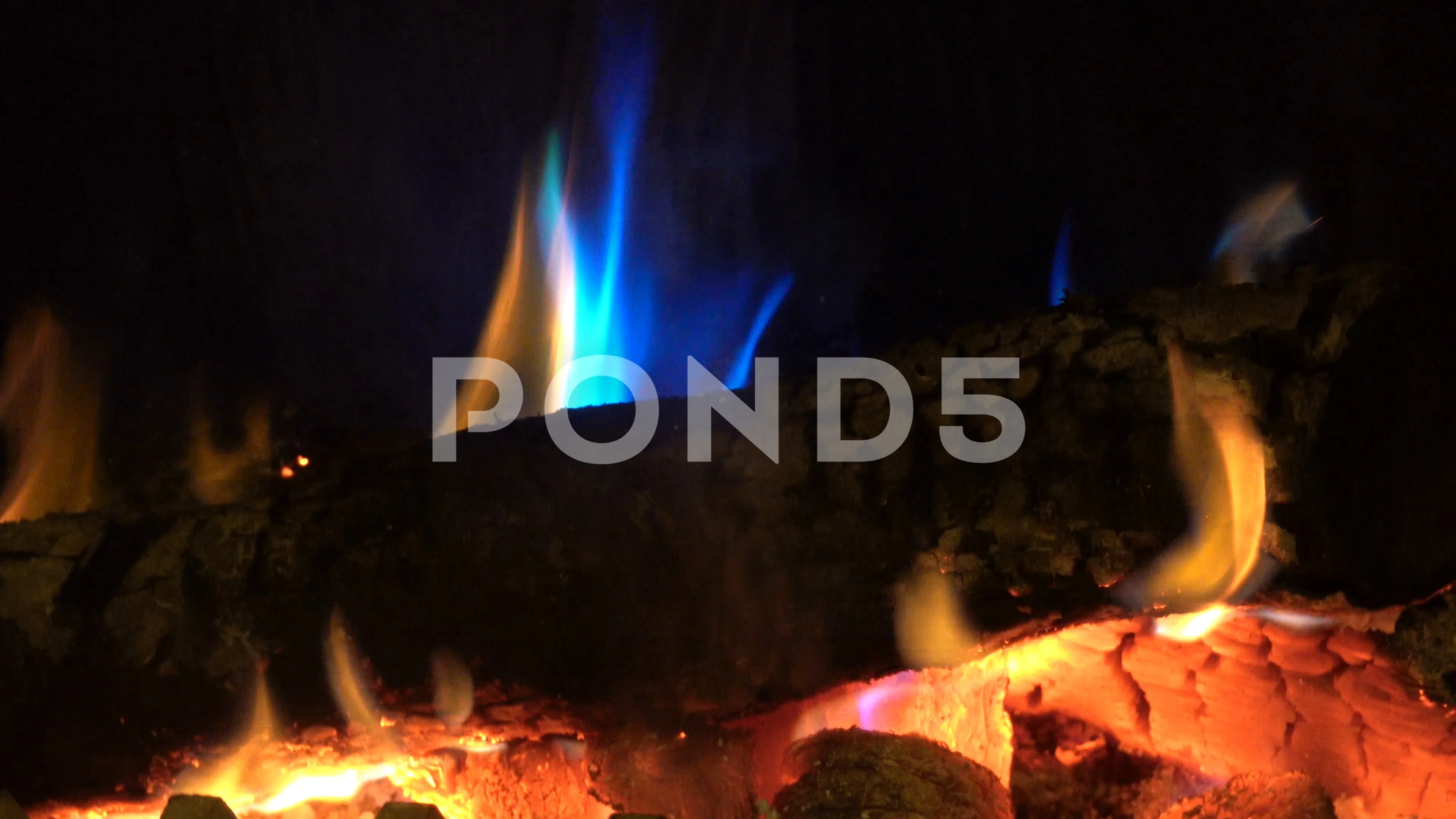 wood burning on open fire place with blu... | Stock Video | Pond5