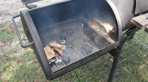 Wood burning on an open grill Stock Footage 61193413