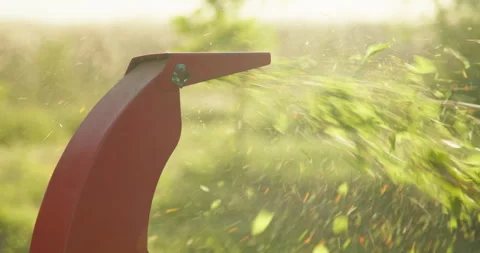 Wood chipper machine shredder tree sawdust branches close up Stock Footage 297944008