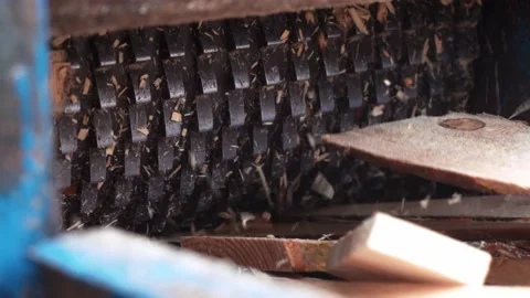 Wood chipper, strong iron teeth of a special press grind wood and turn it into Stock Footage 201086587