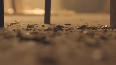Wood chippings falling on floor of workshop Stock Footage 275631691