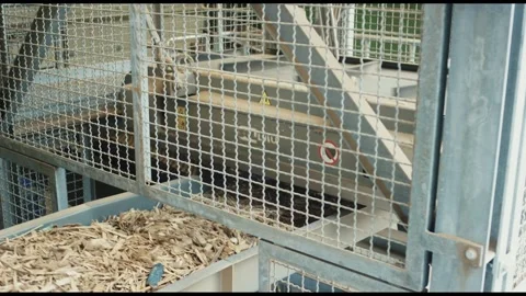 Wood Chips in Container Behind Safety Fence, Biomass Heating Plant, Static Shot Vídeo Stock 341437019