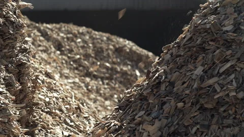 Wood chips falling in slow motion at a sawmill Stock Footage 141308432