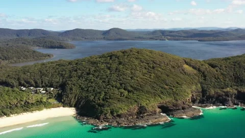 Wood covered hill ranges of Booti Booti nat park in Australia – aerial 4k. Stock Footage 205070064