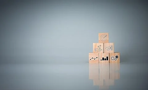 Wood cube block stacking with icon.Concept of business strategy and goal acti Stock Photos
