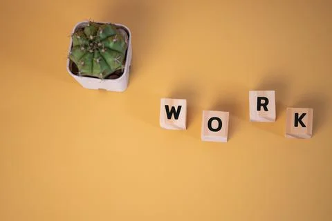 Wood cube block text work on yellow background.copy space Stock Photos