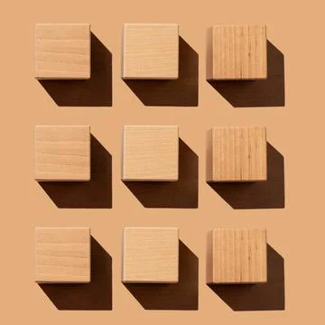 Wood cubes structure of square shape on wooden table Stock Photos