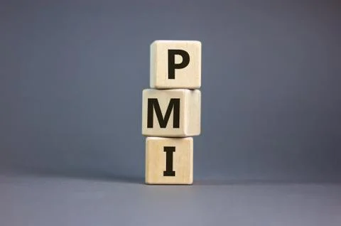 Wood cubes with word 'PMI' stacking as stack on beautiful grey background, co 스톡 사진