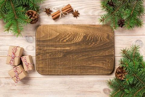 Wood cutting board at table background with christmas decoration, Round boa.. Stock Photos
