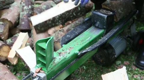 Wood cutting in log making machine Stock Footage 53576970
