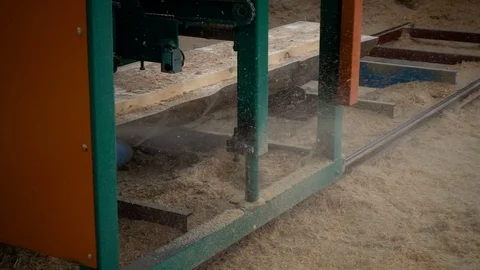 Wood cutting machine board log in a sawmill. slow motion Stock Footage 81328289