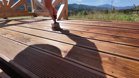 Wood Deck Oiling Varnishing Impregnating with Scenic Mountain View Stock Footage 315148602