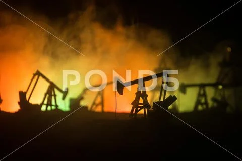 Wood Decoration. Oil pump oil rig energy industrial machine for petroleum in Stock Photos