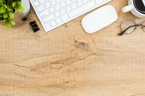 Wood desk table with computer gadgets and supplies. Top view with copy space, Stock Photos