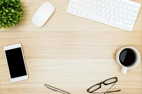 Wood desk table with computer gadgets and supplies. Top view with copy space, Stock Photos