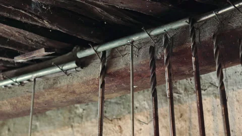 Wood drilling tools hanging on an old workshop Stock Footage 147049033
