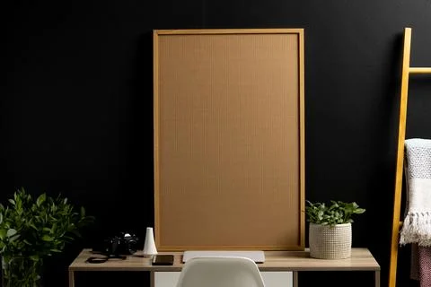 Wood empty frame with copy space, plants and technology devices on desk against Stock Photos