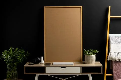 Wood empty frame with copy space, plants and technology devices on desk against Stock Photos