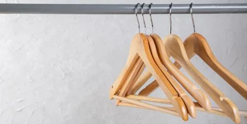 Wood empty hangers on rack with rustick background Stock Photos