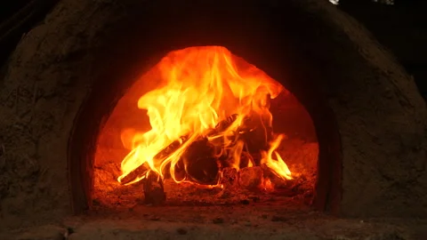 Wood fire burning inside clay oven. Stock Footage 218589782