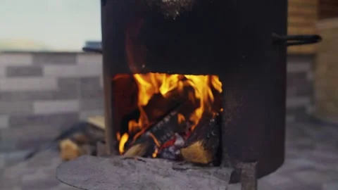Wood Fire Burning Under Large Cauldron for Cooking Plov Outdoors Stock Footage 346539458