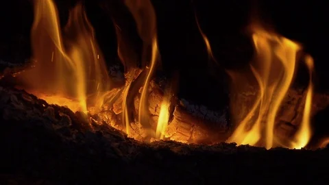 Wood fire in the night inside a fireplace - slowmotion shot 180 fps Stock Footage 86089246