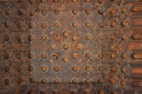 Wood forms the structure of the ceiling in the image. Carvings create pattern Stock Photos