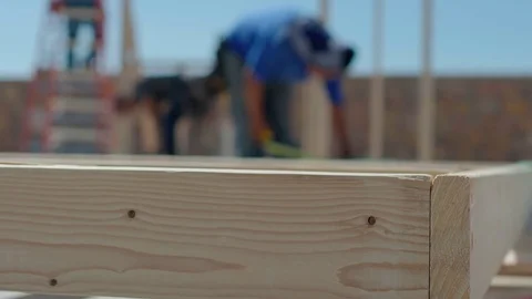 Wood Framing Close Up Move Left with Worker Stock Footage 80834017
