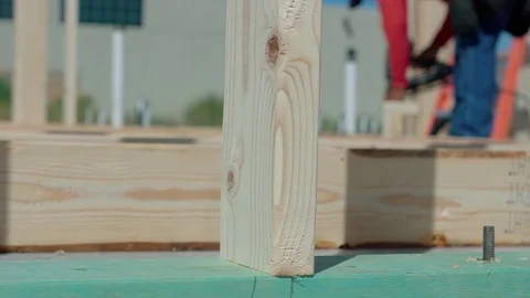 Wood Framing Close Up Move Right with Worker Stock Footage 80833729
