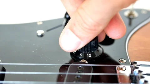 Wood grain electric guitar knobs, switches and pick guard. 動画素材 92719652