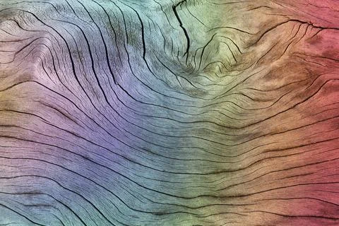 Wood grain texture with a rainbow effect background Stock Photos