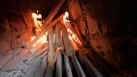 Wood logs burning with bright flames inside stove Stock Footage 321241571