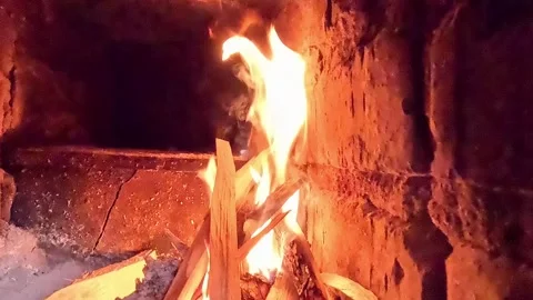 Wood logs catching fire and burning inside brick fireplace Stock Footage 321241613