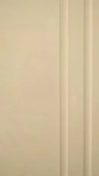 Wood panel with vertical milling of two strips. Close-up. Stock Photos