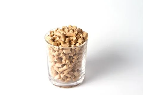 Wood Pellets in the glass Stock Photos