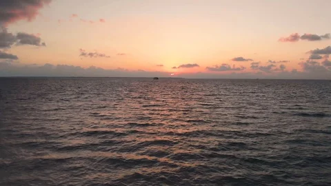 A wood pier or walkway with a palapa at the end at a holiday resort near Cancun Stock-Footage 104125053