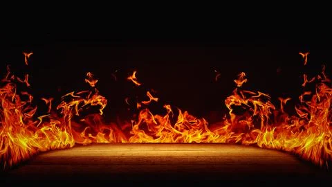 Wood plank surface with dramatic red, orange, and yellow flames with smoke .. Stock Photos