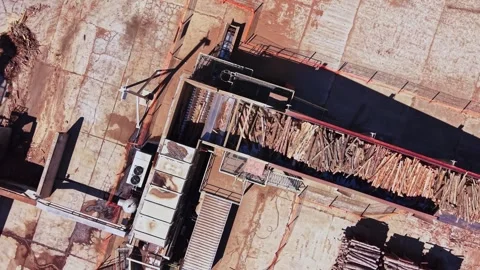 Wood processing facility in operation with logs and machinery Video stock 342604525