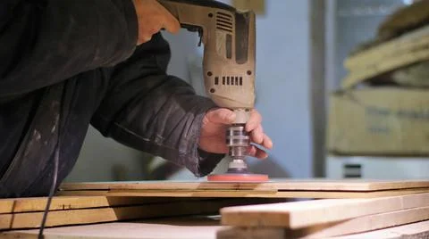Wood processing with a grinding attachment Stock Photos