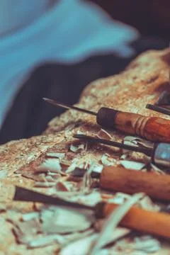 Wood sculptor tools on a table in workshop Stock Photos