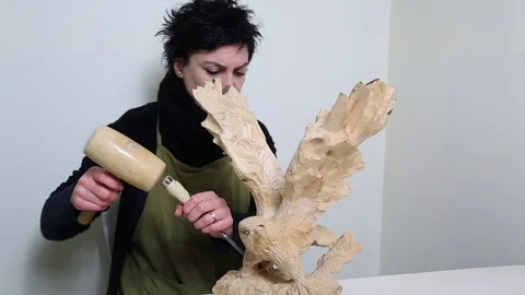 Wood sculptor at work Stock Footage 72099098