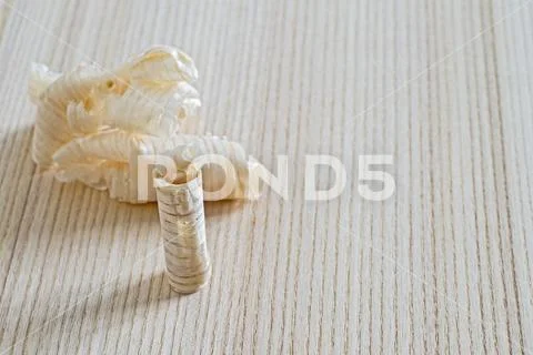 Wood shavings lying on a wooden Board. Background. Do-it-yourself concept. Stock Photos