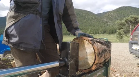 Wood splitter machine at work, close up of log being split. Stock Footage 91756390