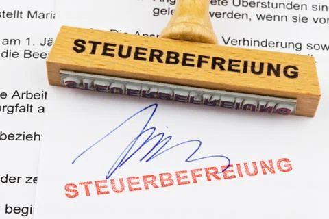Wood stamp on the document: exemption Stock-Fotos